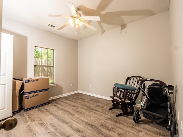 1808 Hidden Crk, Sherwood, AR 72120 - sitting room featuring wood finished floors, a ceiling fan, and baseboards