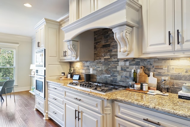 43 Tournay Cir, Little Rock, AR 72223 - kitchen with appliances with stainless steel finishes, tasteful backsplash, crown molding, light stone countertops, and white cabinets