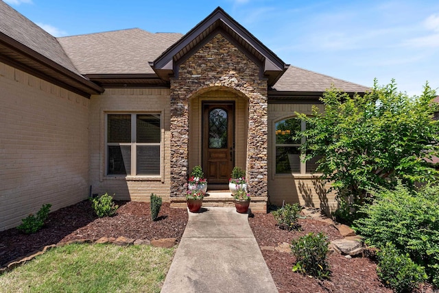 43 Tournay Cir, Little Rock, AR 72223 - doorway to property with a shingled roof, stone siding, and brick siding