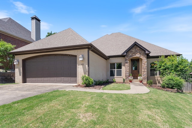 43 Tournay Cir, Little Rock, AR 72223 - french country style house with driveway, roof with shingles, brick siding, and an attached garage