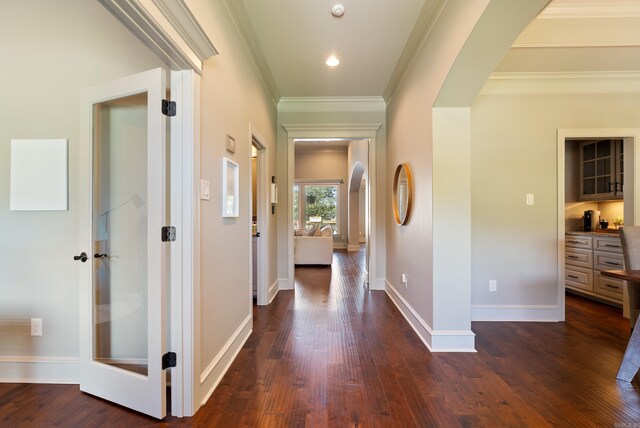 43 Tournay Cir, Little Rock, AR 72223 - hall featuring arched walkways, dark wood finished floors, crown molding, and baseboards