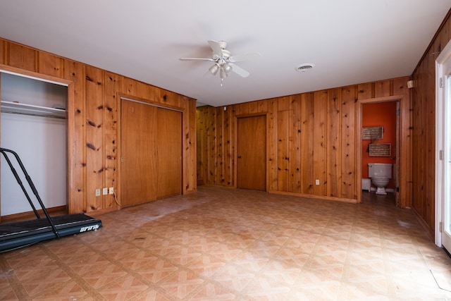 17 Wingate Dr, Little Rock, AR 72205 - unfurnished bedroom with wooden walls, multiple closets, and baseboards