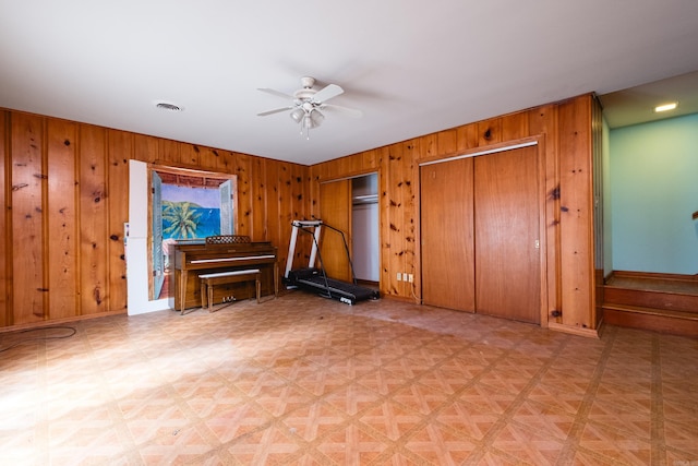17 Wingate Dr, Little Rock, AR 72205 - living room featuring wood walls, a ceiling fan, and baseboards