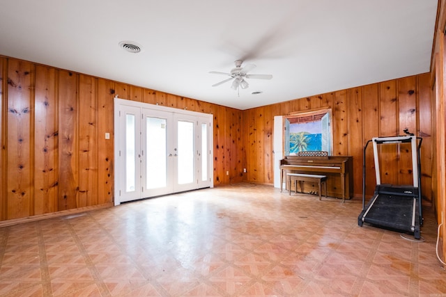 17 Wingate Dr, Little Rock, AR 72205 - living room featuring a ceiling fan, wood walls, and french doors