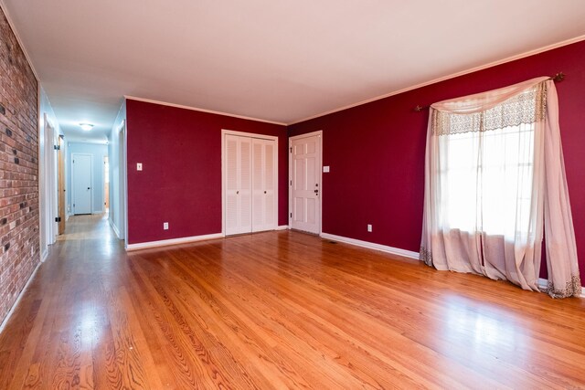 17 Wingate Dr, Little Rock, AR 72205 - spare room with light wood-type flooring, baseboards, and crown molding