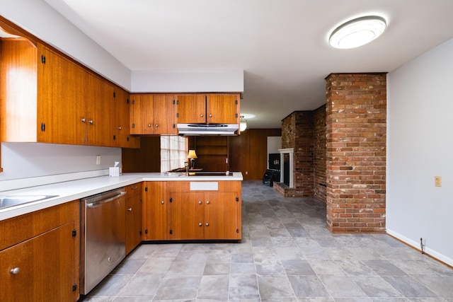 17 Wingate Dr, Little Rock, AR 72205 - kitchen featuring stainless steel dishwasher, under cabinet range hood, brown cabinets, a fireplace, and light countertops