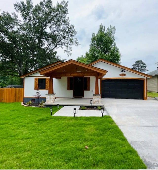1108 Kenwood, Benton, AR 72019 - view of front of house with concrete driveway, a garage, and covered porch