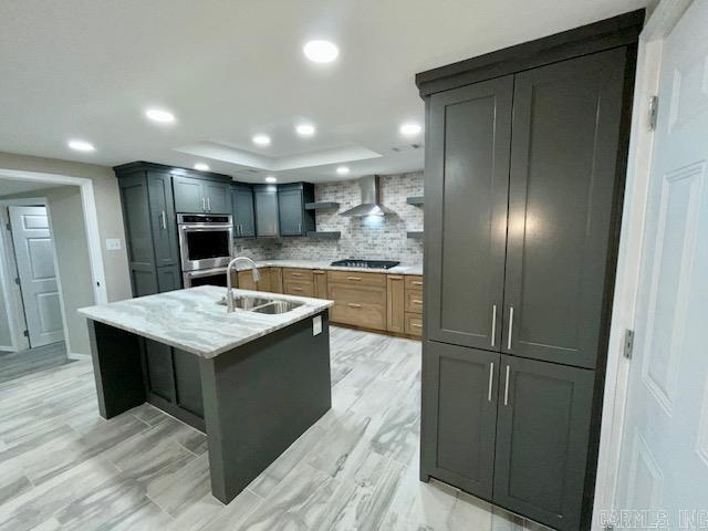 1108 Kenwood, Benton, AR 72019 - kitchen with black cooktop, a sink, open shelves, wall chimney range hood, and tasteful backsplash
