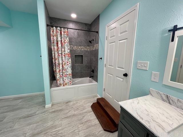 1108 Kenwood, Benton, AR 72019 - full bathroom with vanity, shower / bath combo with shower curtain, and baseboards