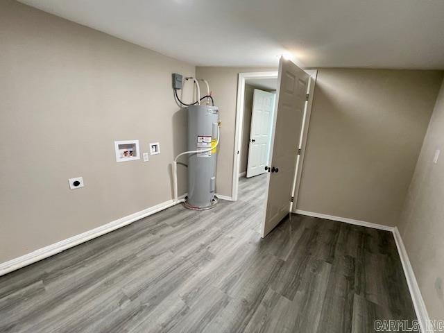 1108 Kenwood, Benton, AR 72019 - below grade area with electric water heater, wood finished floors, and baseboards