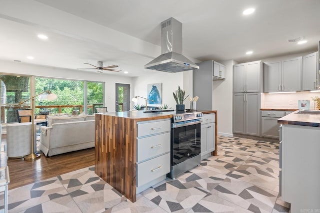 136 Buster Reed Dr, Hot Springs, AR 71913 - kitchen featuring stainless steel electric stove, island exhaust hood, recessed lighting, a sink, and decorative backsplash