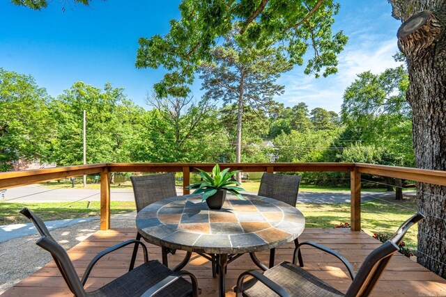 136 Buster Reed Dr, Hot Springs, AR 71913 - wooden terrace with outdoor dining area and a view of trees