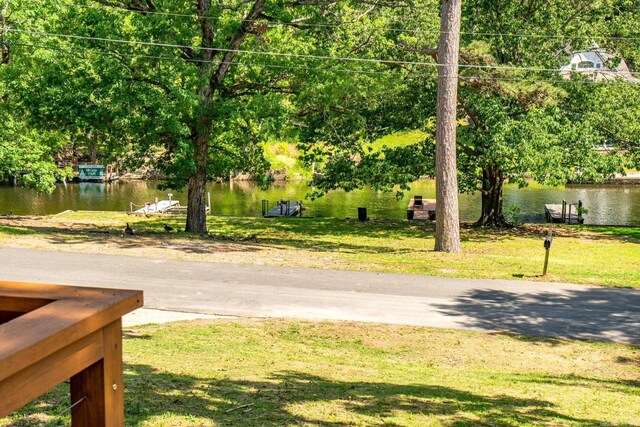 136 Buster Reed Dr, Hot Springs, AR 71913 - view of green lawn featuring a water view and view of wooded area