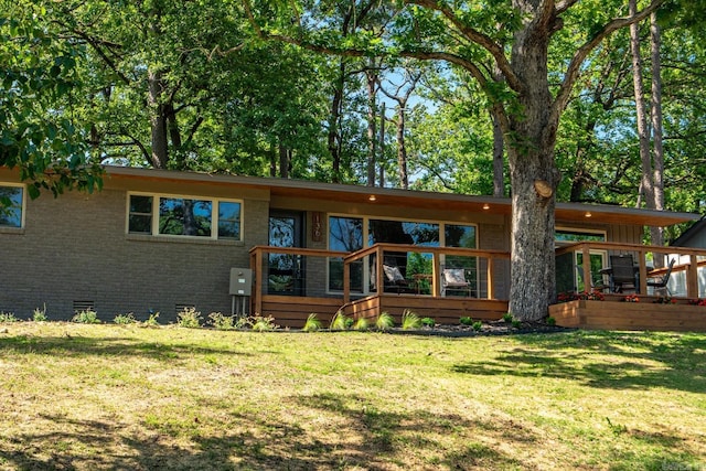 136 Buster Reed Dr, Hot Springs, AR 71913 - rear view of house featuring brick siding, crawl space, and a yard