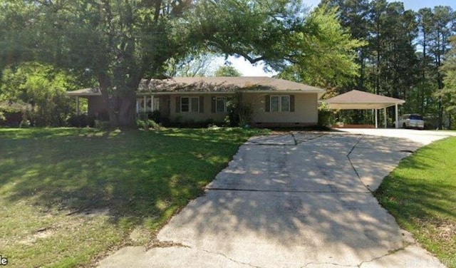 707 E Padgett, El Dorado, AR 71730 - ranch-style home featuring concrete driveway, a carport, and a front yard
