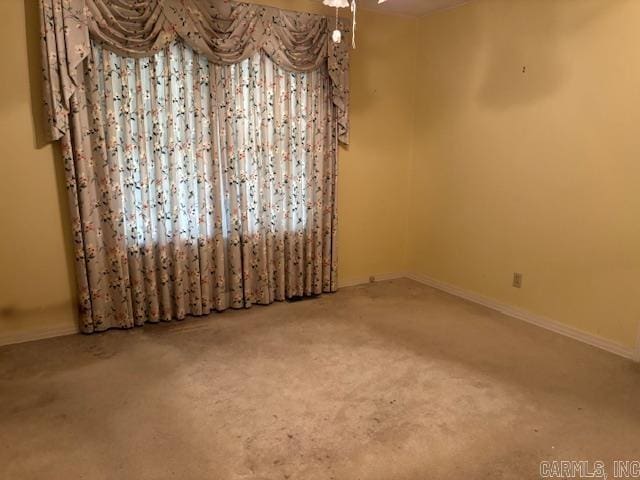 707 E Padgett, El Dorado, AR 71730 - carpeted spare room featuring baseboards