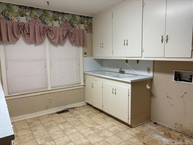 707 E Padgett, El Dorado, AR 71730 - laundry area with hookup for a washing machine and cabinet space
