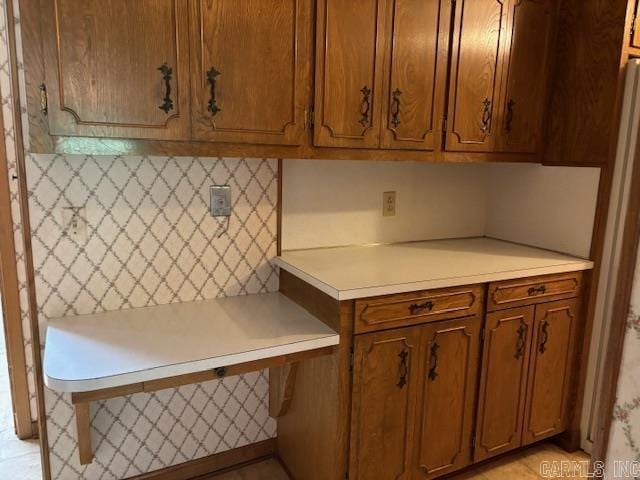 707 E Padgett, El Dorado, AR 71730 - kitchen with light countertops and brown cabinets