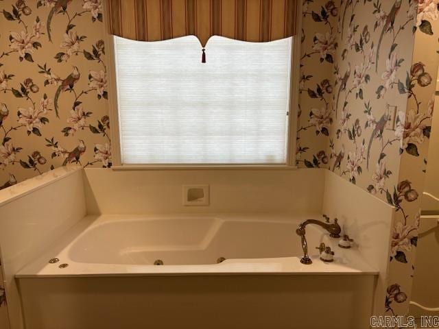 707 E Padgett, El Dorado, AR 71730 - bathroom with wallpapered walls and a whirlpool tub