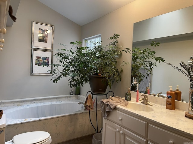 8 Evergreen Ct, Little Rock, AR 72227 - bathroom featuring vanity, a bath, lofted ceiling, and toilet