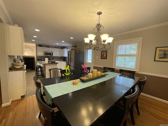 8 Evergreen Ct, Little Rock, AR 72227 - dining room with crown molding, light wood finished floors, a chandelier, recessed lighting, and baseboards