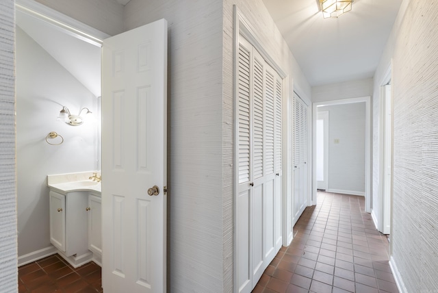 2805 Foxcroft Rd Unit 602, Little Rock, AR 72227 - corridor with dark tile patterned flooring and baseboards