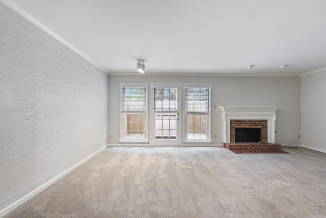 2805 Foxcroft Rd Unit 602, Little Rock, AR 72227 - unfurnished living room featuring crown molding, carpet, baseboards, and a brick fireplace