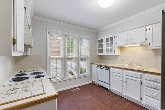 2805 Foxcroft Rd Unit 602, Little Rock, AR 72227 - kitchen featuring white appliances, a sink, white cabinets, decorative backsplash, and crown molding