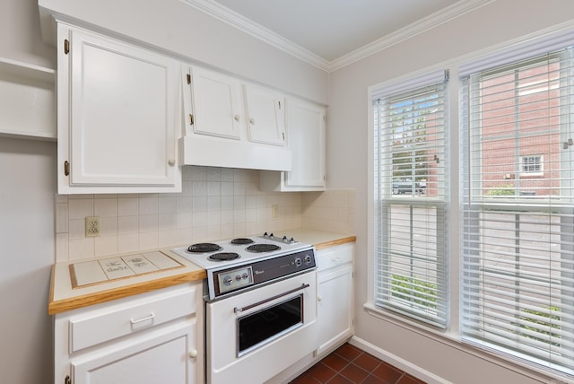 2805 Foxcroft Rd Unit 602, Little Rock, AR 72227 - kitchen featuring white electric stove, light countertops, exhaust hood, white cabinets, and ornamental molding