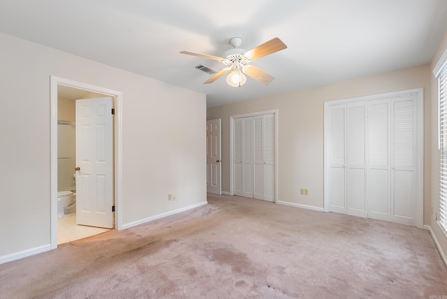2805 Foxcroft Rd Unit 602, Little Rock, AR 72227 - unfurnished bedroom featuring carpet, baseboards, and multiple closets