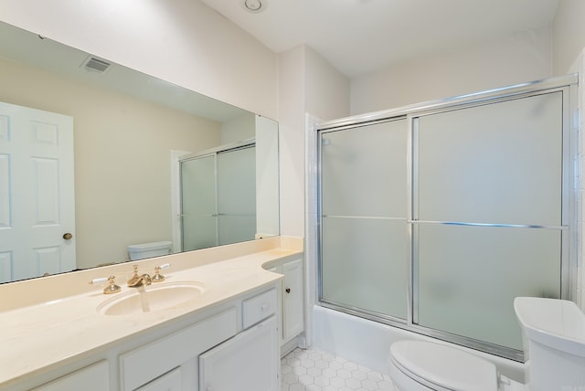 2805 Foxcroft Rd Unit 602, Little Rock, AR 72227 - bathroom with toilet, tile patterned flooring, vanity, and shower / bath combination with glass door