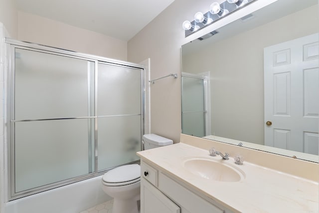 2805 Foxcroft Rd Unit 602, Little Rock, AR 72227 - bathroom featuring toilet, tile patterned flooring, vanity, and enclosed tub / shower combo