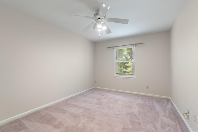 2805 Foxcroft Rd Unit 602, Little Rock, AR 72227 - spare room with light colored carpet, baseboards, and a ceiling fan