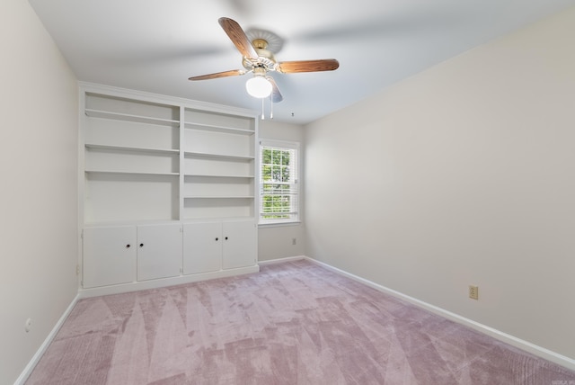 2805 Foxcroft Rd Unit 602, Little Rock, AR 72227 - empty room featuring ceiling fan, baseboards, and light carpet