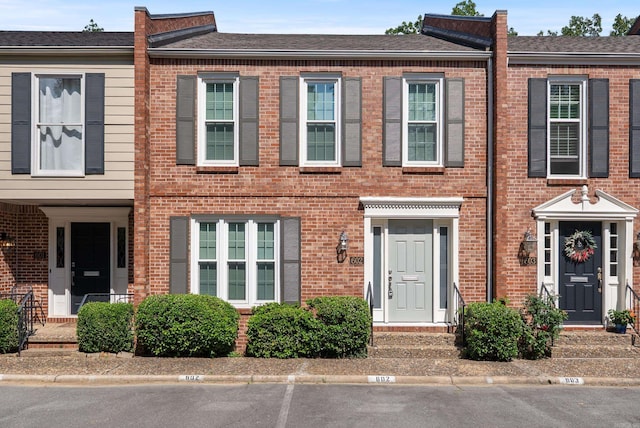 2805 Foxcroft Rd Unit 602, Little Rock, AR 72227 - view of property with brick siding and uncovered parking