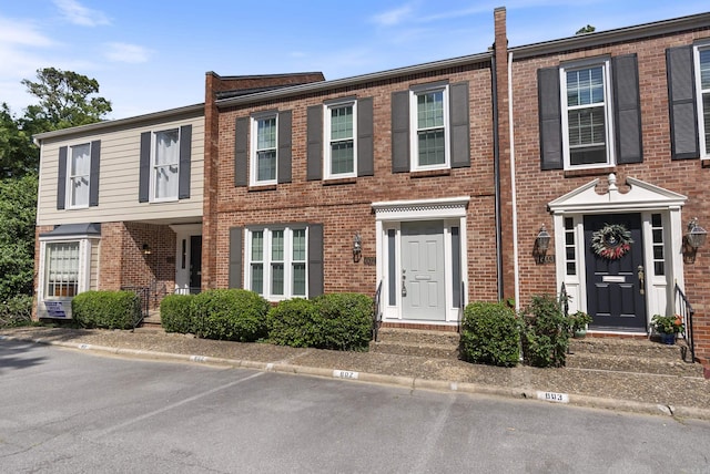 2805 Foxcroft Rd Unit 602, Little Rock, AR 72227 - view of property featuring brick siding and uncovered parking