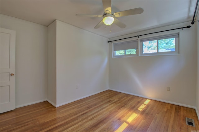 6800 Stamps Ct, Little Rock, AR 72207 - empty room with light wood-style floors, baseboards, and a ceiling fan