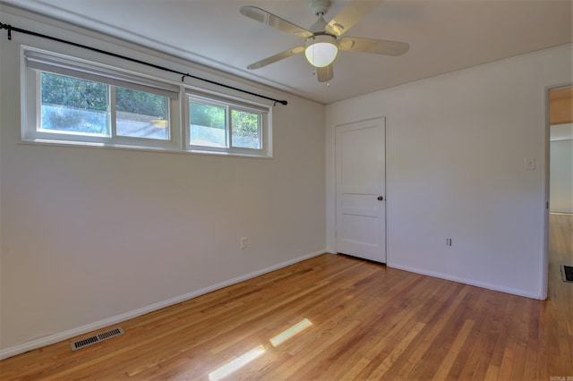 6800 Stamps Ct, Little Rock, AR 72207 - unfurnished bedroom featuring light wood-type flooring, baseboards, crown molding, and a ceiling fan