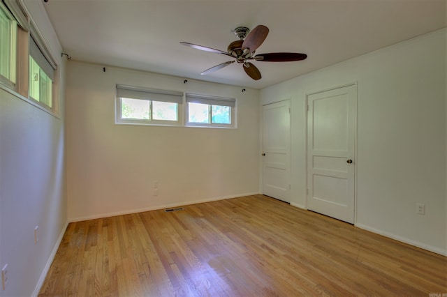 6800 Stamps Ct, Little Rock, AR 72207 - unfurnished room featuring light wood-style flooring, ceiling fan, and baseboards