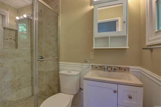 6800 Stamps Ct, Little Rock, AR 72207 - bathroom featuring wainscoting, a stall shower, toilet, and vanity