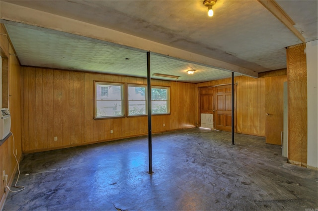 6800 Stamps Ct, Little Rock, AR 72207 - below grade area with wooden walls, tile patterned floors, and baseboards
