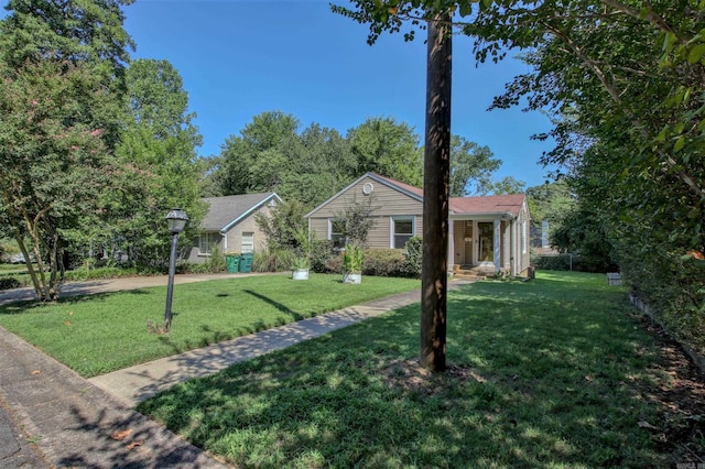 6800 Stamps Ct, Little Rock, AR 72207 - ranch-style house featuring a front yard