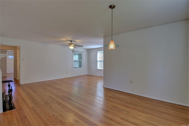 6800 Stamps Ct, Little Rock, AR 72207 - unfurnished living room featuring ceiling fan, light wood-type flooring, and baseboards