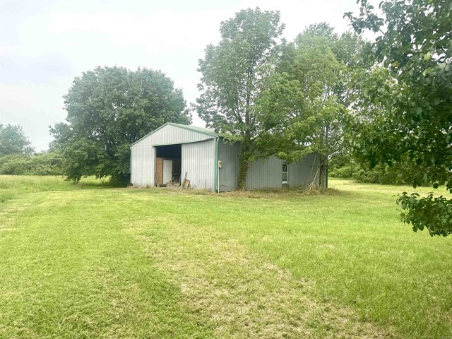 105 Traci Ln, Heber Springs, AR 72543 - view of green lawn with a pole building and an outbuilding