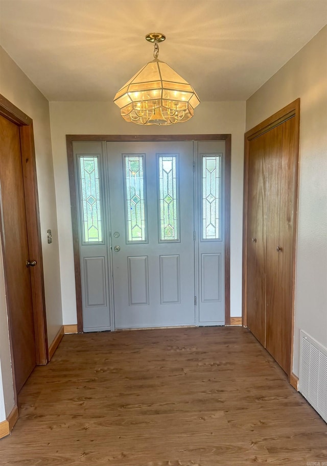 105 Traci Ln, Heber Springs, AR 72543 - entryway with a chandelier, light wood-style floors, and baseboards