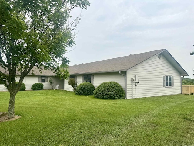 105 Traci Ln, Heber Springs, AR 72543 - view of home's exterior with a yard and roof with shingles