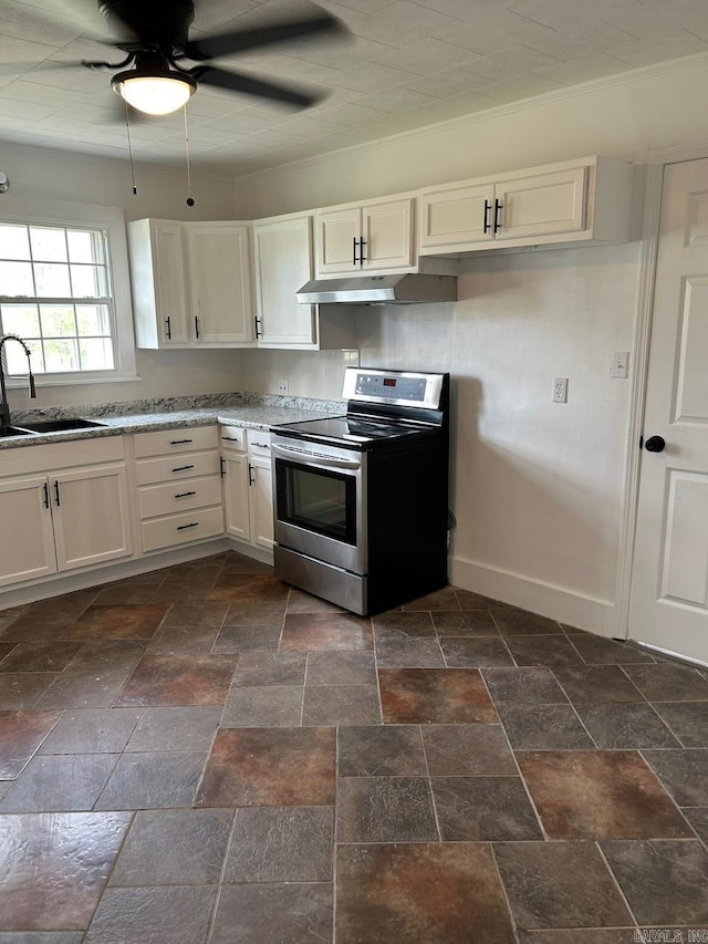 601 N Hickory, Searcy, AR 72143 - kitchen featuring electric stove, a sink, under cabinet range hood, ceiling fan, and stone tile flooring
