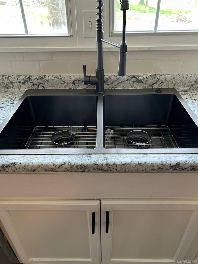601 N Hickory, Searcy, AR 72143 - kitchen view of a sink, white cabinetry, and light stone countertops