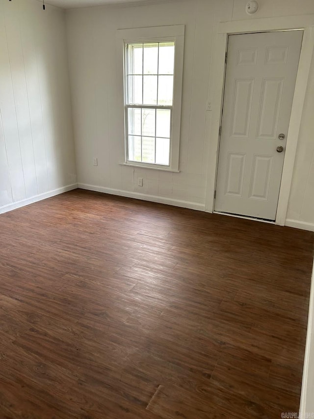 601 N Hickory, Searcy, AR 72143 - spare room featuring dark wood-style flooring and baseboards