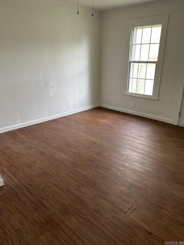 601 N Hickory, Searcy, AR 72143 - spare room featuring dark wood-style floors and baseboards